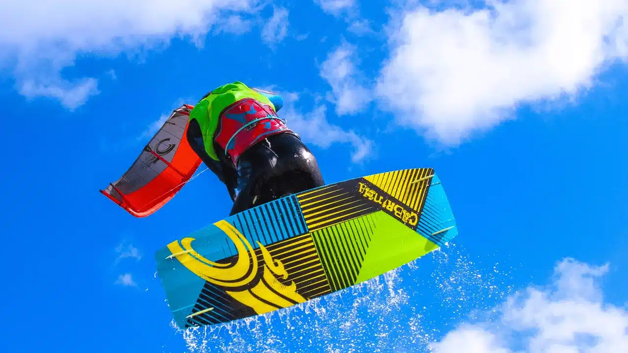 Kitesurfer Catching Air Against a Bright Blue Sky Kitesurfer Catching Air Against a Bright Blue Sky
