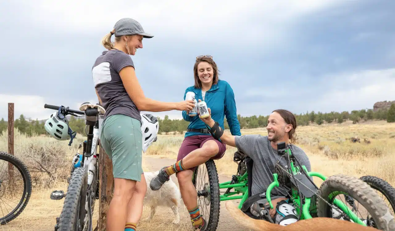 Friends Toasting with Beers During a Mountain Biking Adventure Friends Toasting with Beers During a Mountain Biking Adventure