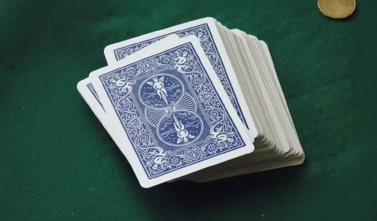 Deck of Playing Cards on a Green Table ( Deck of Playing Cards on a Green Table (