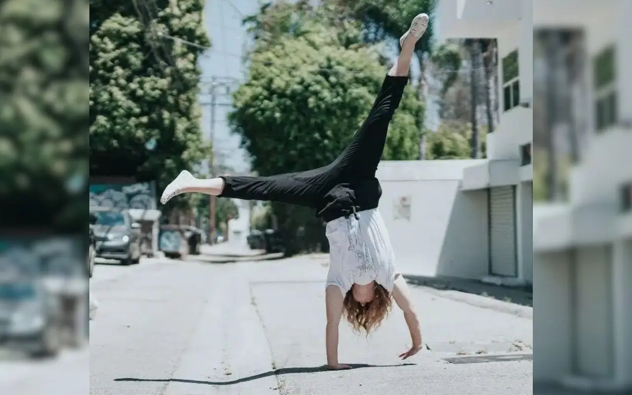 Woman Doing a Cartwheel on a Sunny Street 2 (1) Woman Doing a Cartwheel on a Sunny Street 2 (1)