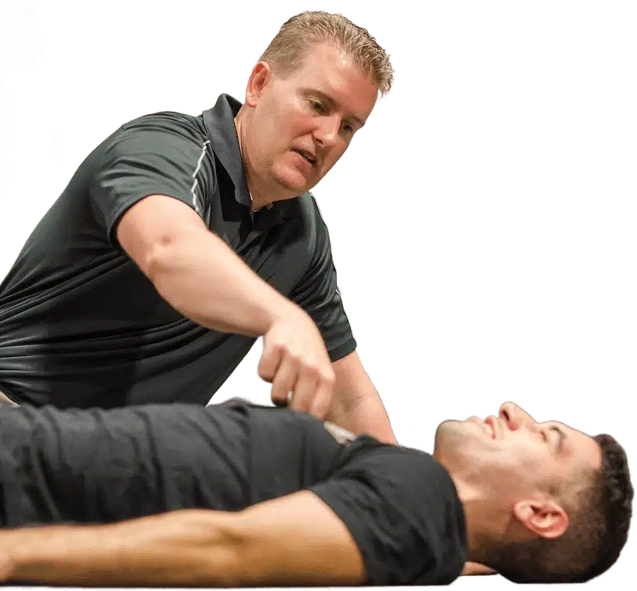 Dr Mike T Nelson With client lying down for demonstration