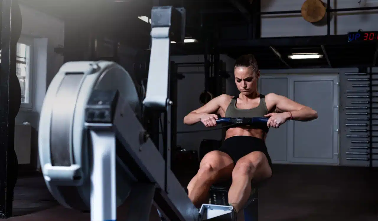 Power and Endurance Woman on Rowing Machine Power and Endurance Woman on Rowing Machine