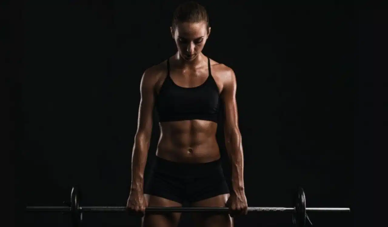 Strength in Focus Female Athlete with Barbell Strength in Focus Female Athlete with Barbell